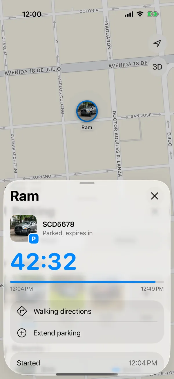 A parked vehicle with the time left, Walking directions and Extend parking